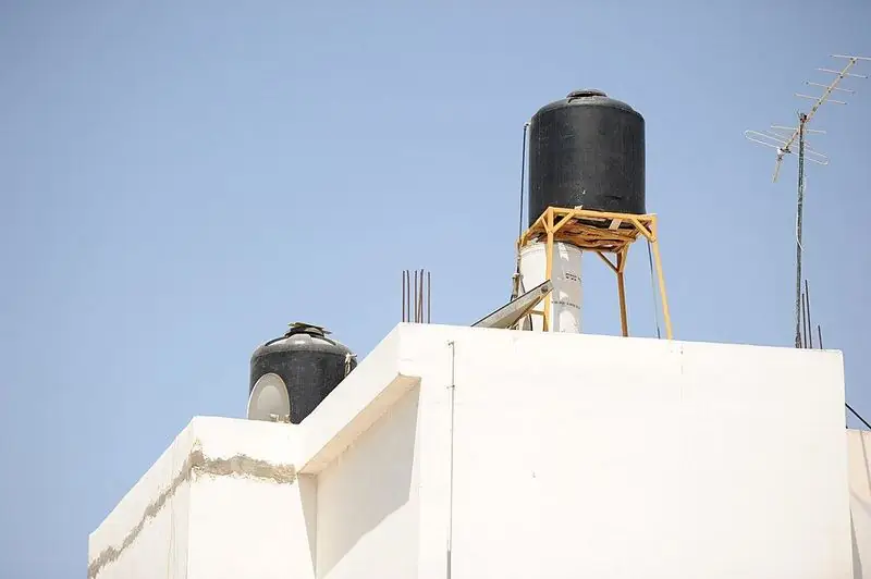 Water tanks on a rooftop in Jenin.